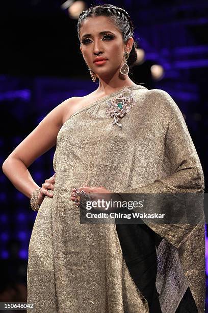 Model walks the runway at the PCJ Grand Finale show of India International Jewellery Week 2012 day 5 at the Grand Hyatt on August 23, 2012 in Mumbai,...