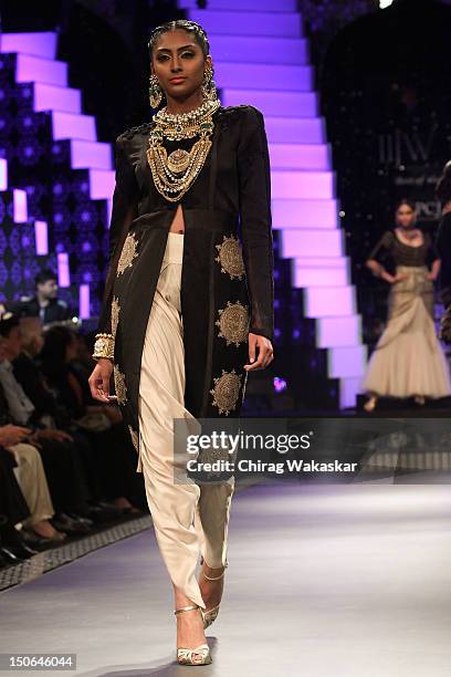 Model walks the runway at the PCJ Grand Finale show of India International Jewellery Week 2012 day 5 at the Grand Hyatt on August 23, 2012 in Mumbai,...