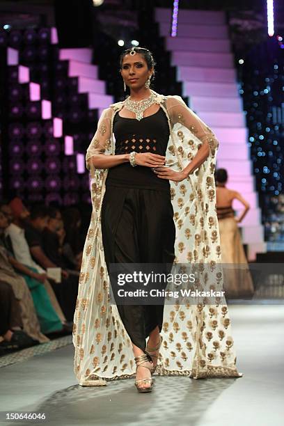 Model walks the runway at the PCJ Grand Finale show of India International Jewellery Week 2012 day 5 at the Grand Hyatt on August 23, 2012 in Mumbai,...