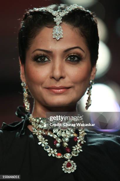 Model walks the runway at the PCJ Grand Finale show of India International Jewellery Week 2012 day 5 at the Grand Hyatt on August 23, 2012 in Mumbai,...