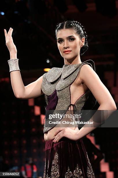 Model walks the runway at the PCJ Grand Finale show of India International Jewellery Week 2012 day 5 at the Grand Hyatt on August 23, 2012 in Mumbai,...