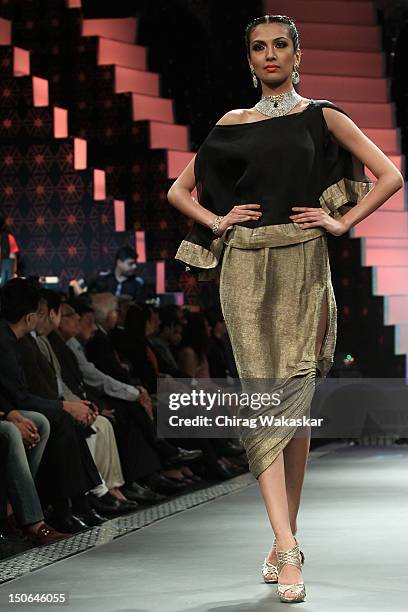 Model walks the runway at the PCJ Grand Finale show of India International Jewellery Week 2012 day 5 at the Grand Hyatt on August 23, 2012 in Mumbai,...