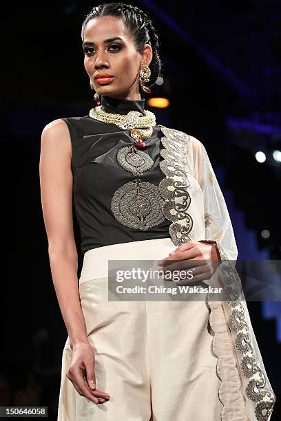 Model walks the runway at the PCJ Grand Finale show of India International Jewellery Week 2012 day 5 at the Grand Hyatt on August 23, 2012 in Mumbai,...