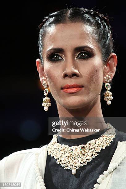 Model walks the runway at the PCJ Grand Finale show of India International Jewellery Week 2012 day 5 at the Grand Hyatt on August 23, 2012 in Mumbai,...