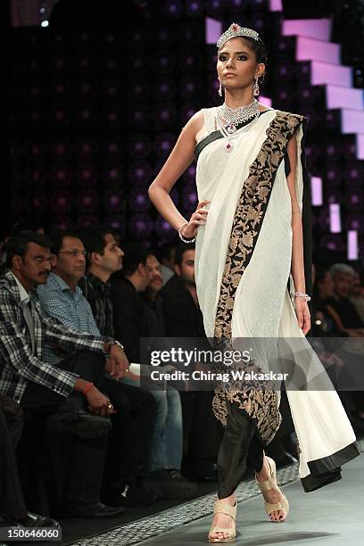 Model walks the runway at the PCJ Grand Finale show of India International Jewellery Week 2012 day 5 at the Grand Hyatt on August 23, 2012 in Mumbai,...