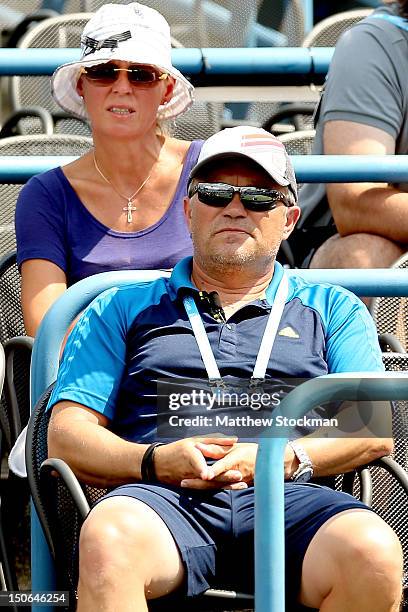 Anna and Piotr Wozniacki, parents of Caroline Wozniacki of Denmark, watche as she plays Dominika Cibulkova of Slovakia during the New Haven Open at...