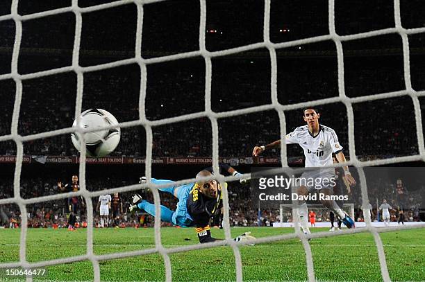 Angel Di Maria of Real Madrid CF scores his team's second goal during the Super Cup first leg match between FC Barcelona and Real Madrid at Camp Nou...