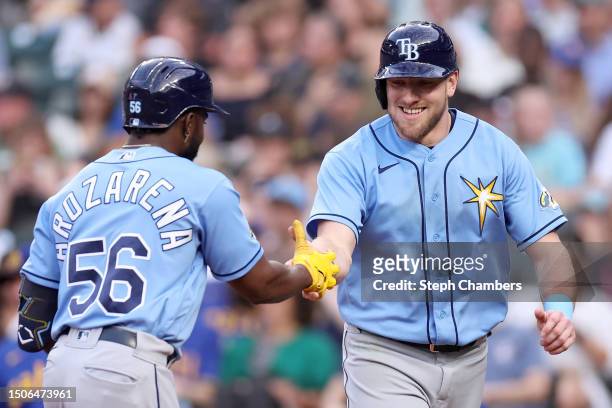 Randy Arozarena of the Tampa Bay Rays celebrates his two run home run with Luke Raley against the Seattle Mariners during the fourth inning at...