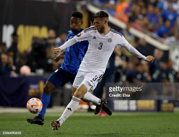 Juan Pablo Vargas of Costa Rica and Cristian Gil of El Salvador go after the ball in the second half during the Group C match of the 2023 Concacaf...