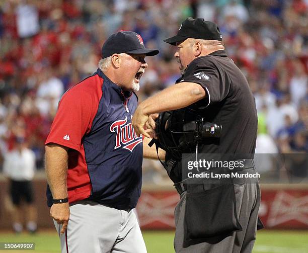 Manager Ron Gardenhire of the Minnesota Twins is ejected by home plate umpire Wally Bell after arguing about his pitcher Scott Diamond being ejected...