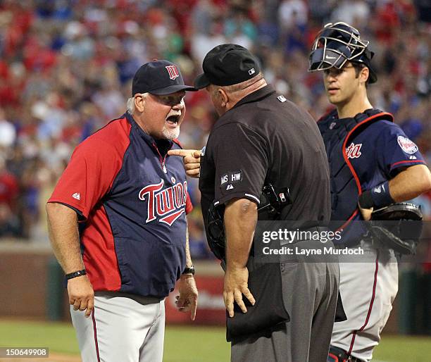 Manager Ron Gardenhire of the Minnesota Twins is ejected by home plate umpire Wally Bell after arguing about his pitcher Scott Diamond being ejected...