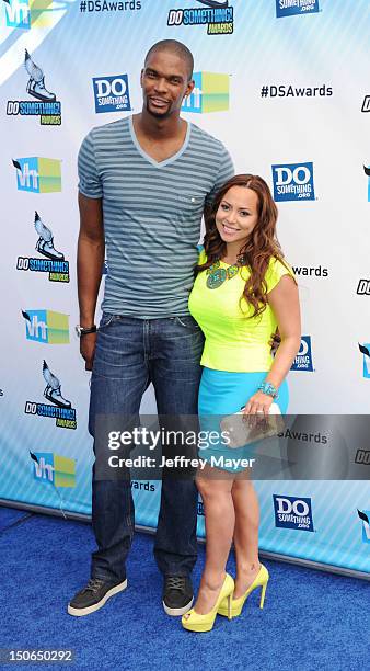 Chris Bosh and Adrienne Williams arrive at the 2012 Do Something Awards at Barker Hangar on August 19, 2012 in Santa Monica, California.