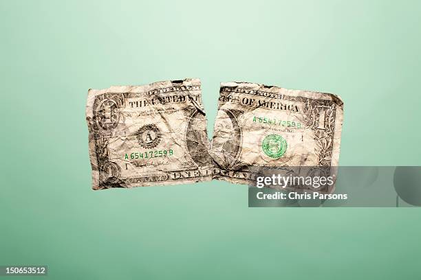 crumpled up and torn dollar bill - weakness stock pictures, royalty-free photos & images