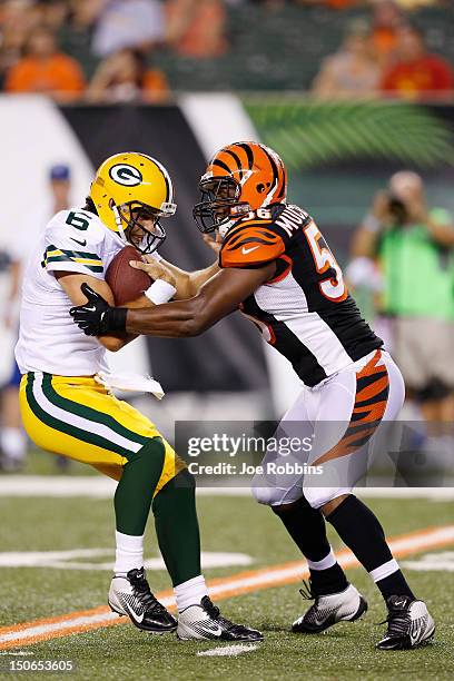 Roddrick Muckelroy of the Cincinnati Bengals sacks Graham Harrell of the Green Bay Packers during a preseason NFL game at Paul Brown Stadium on...