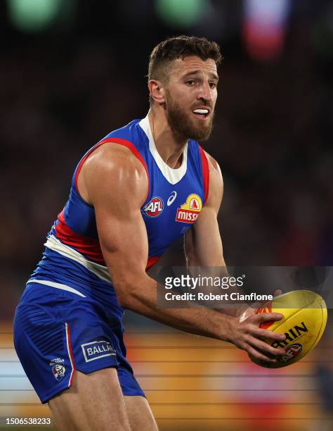 Marcus Bontempelli of the Bulldogs runs with the ball during the round 16 AFL match between Western Bulldogs and Fremantle Dockers at Marvel Stadium,...