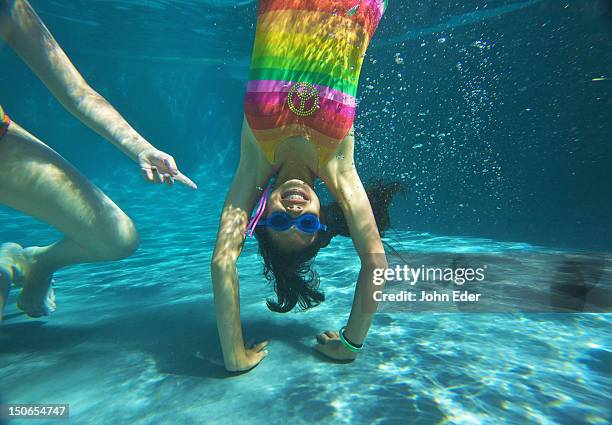 girl doing a headstand underwater in a pool - upside down stock pictures, royalty-free photos & images