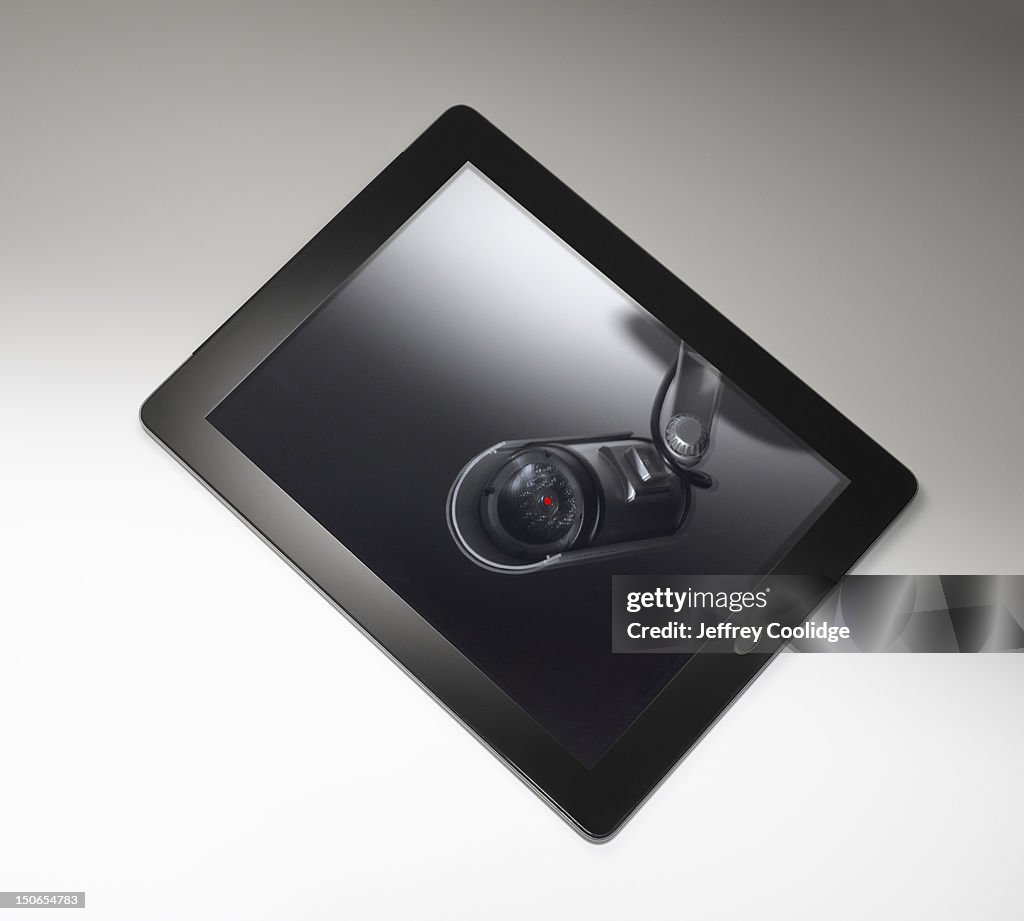 Security Camera Reflected in Digital Tablet