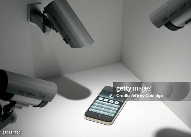 smart phone with security cameras - malware stock pictures, royalty-free photos & images