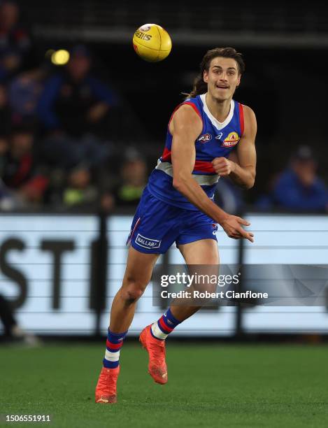 Caleb Pulter of the Bulldogs handballs during the round 16 AFL match between Western Bulldogs and Fremantle Dockers at Marvel Stadium, on July 01 in...