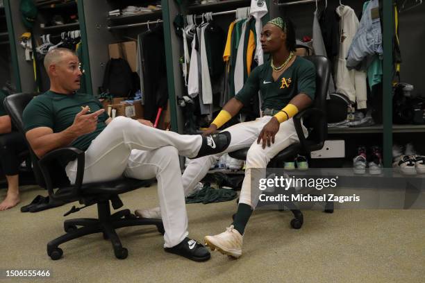 Major League Staff Assistant Ramon Hernandez and Esteury Ruiz of the Oakland Athletics in the clubhouse after the game against the Tampa Bay Rays at...