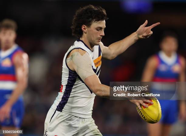 Jordan Clark of the Dockers controls the ball during the round 16 AFL match between Western Bulldogs and Fremantle Dockers at Marvel Stadium, on July...