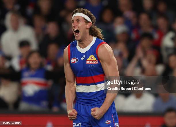 Aaron Naughton of the Bulldogs celebrates after scoring a goal during the round 16 AFL match between Western Bulldogs and Fremantle Dockers at Marvel...