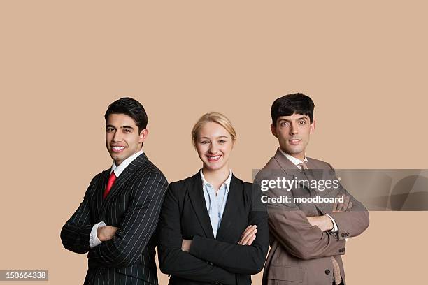 portrait of young multiethnic team with arms crossed over colored background - female with group of males stock pictures, royalty-free photos & images