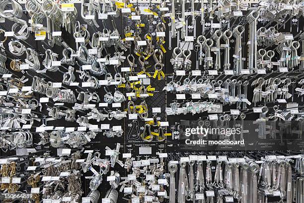 large group of metallic equipments on display in hardware store - ferramenta foto e immagini stock