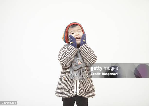 a girl wearing in winter clothes - girl in winter coat studio stock pictures, royalty-free photos & images