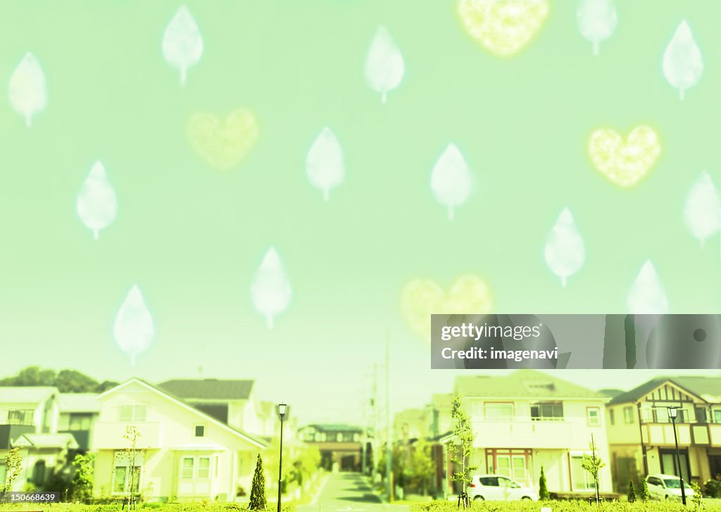 Leaves floating and hearts above residential area