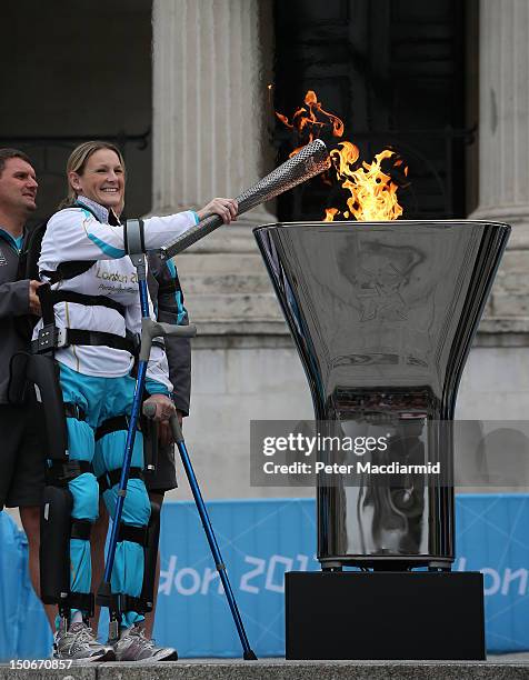 Disabled marathon runner Claire Lomas lights the Olympic cauldron for the Paralympic Games in Trafalgar Square on August 24, 2012 in London, England....