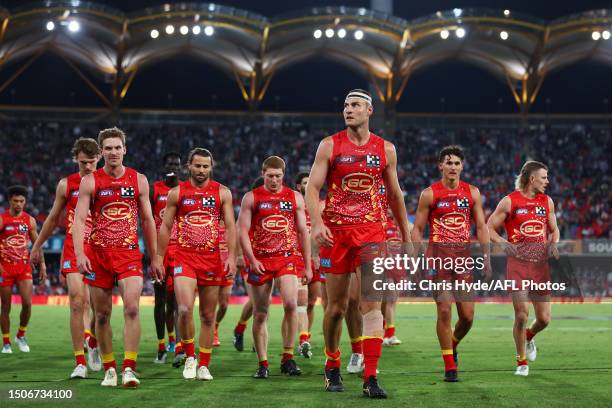 Jarrod Witts and the Suns leave the field at half time during the round 16 AFL match between Gold Coast Suns and Collingwood Magpies at Heritage Bank...