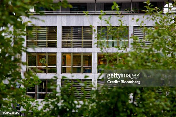 Office rooms are illuminated inside the building that houses the headquarters of Xstrata Plc in Zug, Switzerland, on Friday, Aug. 24, 2012....