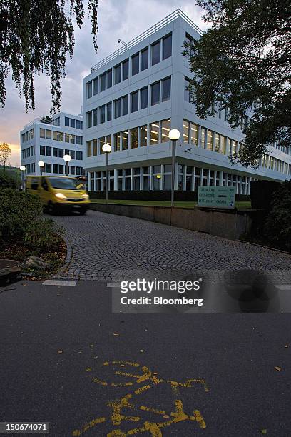 Van exits the headquarters of Glencore International Plc in Baar, Switzerland, on Friday, Aug. 24, 2012. Glencore's planned takeover of Zug,...