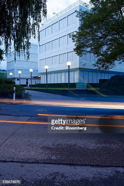 Light trails made by passing vehicles are seen in front of Glencore International Plc's headquarters in Baar, Switzerland, on Friday, Aug. 24, 2012....