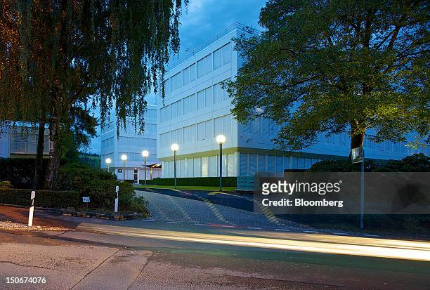 Light trails made by passing vehicles are seen in front of Glencore International Plc's headquarters in Baar, Switzerland, on Friday, Aug. 24, 2012....