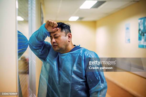 depressed male surgeon - ambulance staff stock pictures, royalty-free photos & images