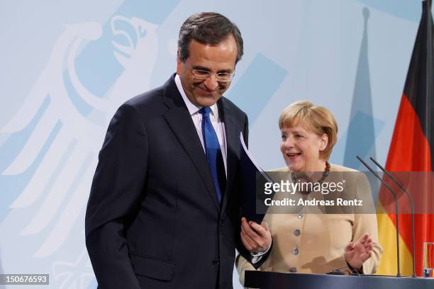 German Chancellor Angela Merkel and Greek Prime Minister Antonis Samaras speak during a press statement at the Chancellery on August 24, 2012 in...