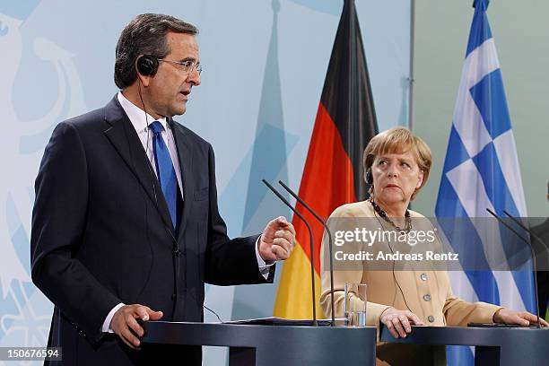 German Chancellor Angela Merkel and Greek Prime Minister Antonis Samaras speak during a press statement at the Chancellery on August 24, 2012 in...