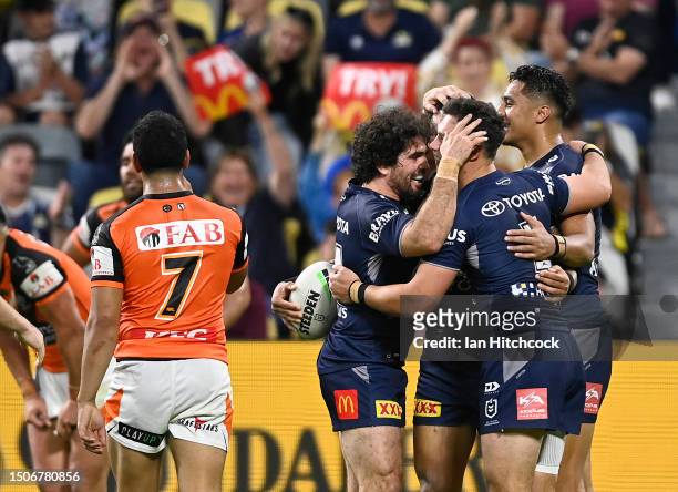 Scott Drinkwater of the Cowboys celebrates after scoring a try during the round 18 NRL match between North Queensland Cowboys and Wests Tigers at Qld...