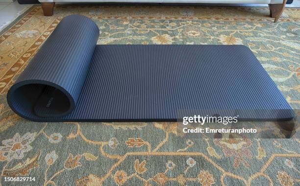 close up of pilates mat on the carpet. - yoga mat stock pictures, royalty-free photos & images