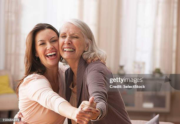 mother and daughter dancing - senior women dancing stock pictures, royalty-free photos & images