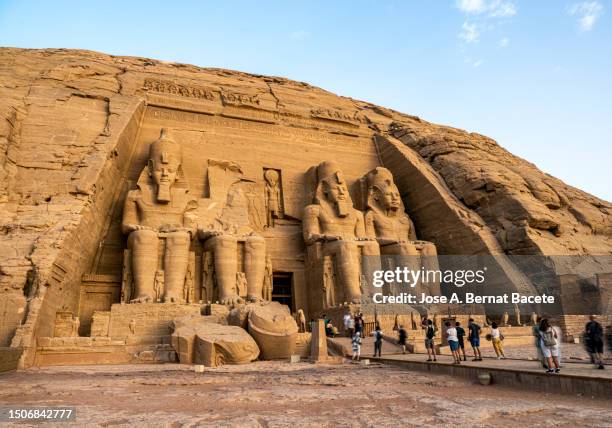 tourists visiting the great temple of abu simbel (great temple of rameses ii) in egypt. - pharaoh stock pictures, royalty-free photos & images