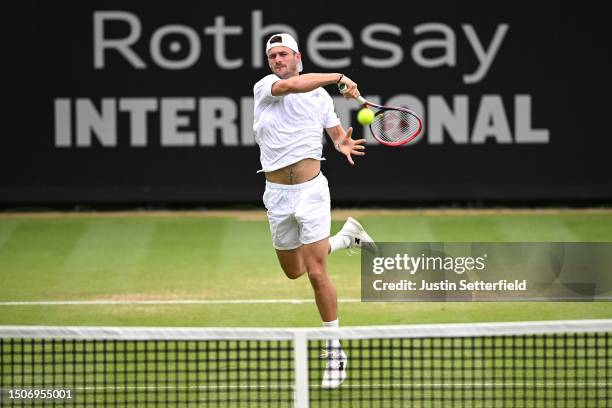 Tommy Paul of United States plays a forehand during his semi final match against Gregoire Barrere of France during Day Eight of the Rothesay...