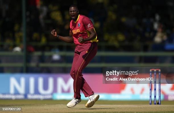 Jason Holder of West Indies celebrates the wicket of Chris McBride of Scotland during the ICC Men's Cricket World Cup Qualifier Zimbabwe 2023 Super 6...
