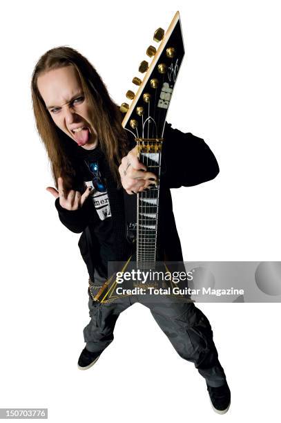 Portrait of Alexi Laiho, frontman with Finnish death metal group Children of Bodom, posing with one of his signature ESP guitars, taken on November...