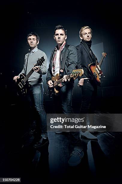 This image has been digitally manipulated) Mike Lewis, Stuart Richardson and Lee Gaze of Welsh hard rock group Lostprophets at The Forum in London,...