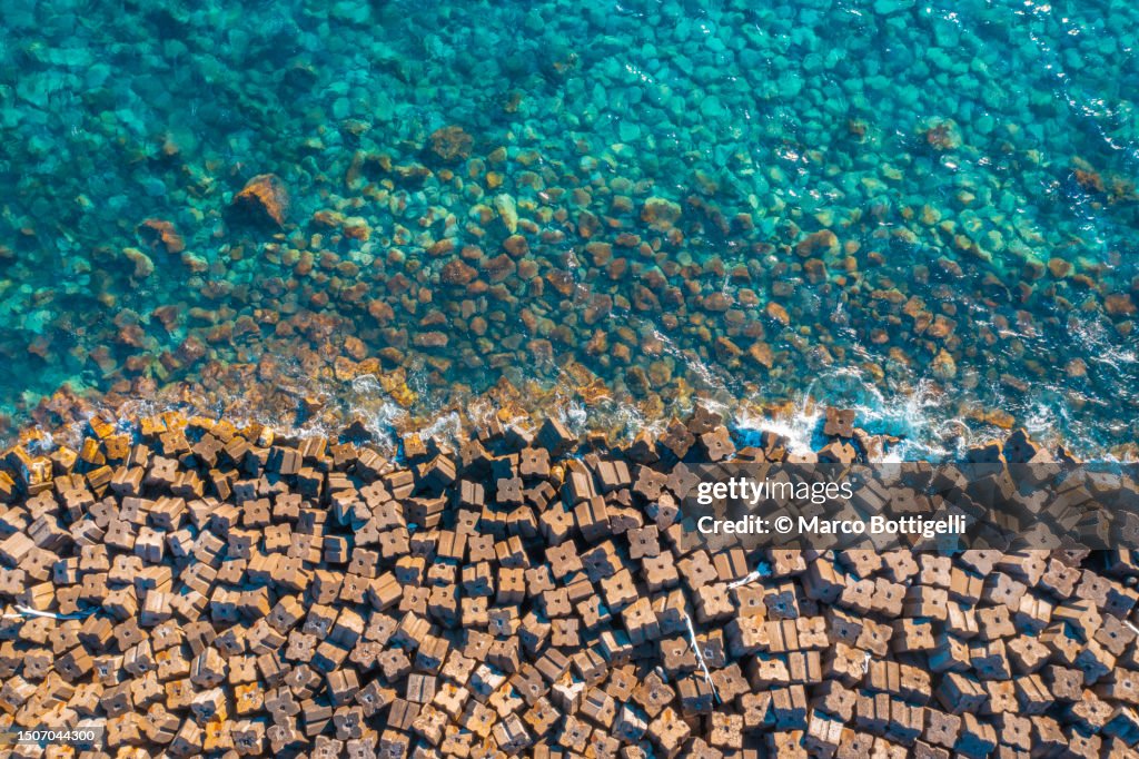 Aerial view of breakwater structure along the coast of Madeira, Portugal