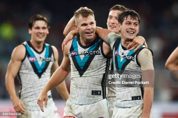 Dan Houston of the Power celebrates with Zak Butters of the Power after kicking the winning goal after the final siren during the round 16 AFL match...