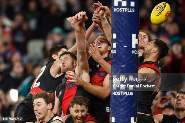 Sam Durham, Jayden Laverde, Andrew Phillips, Peter Wright and Kyle Langford of the Bombers attempt to spoil the goal from Dan Houston of the Power...